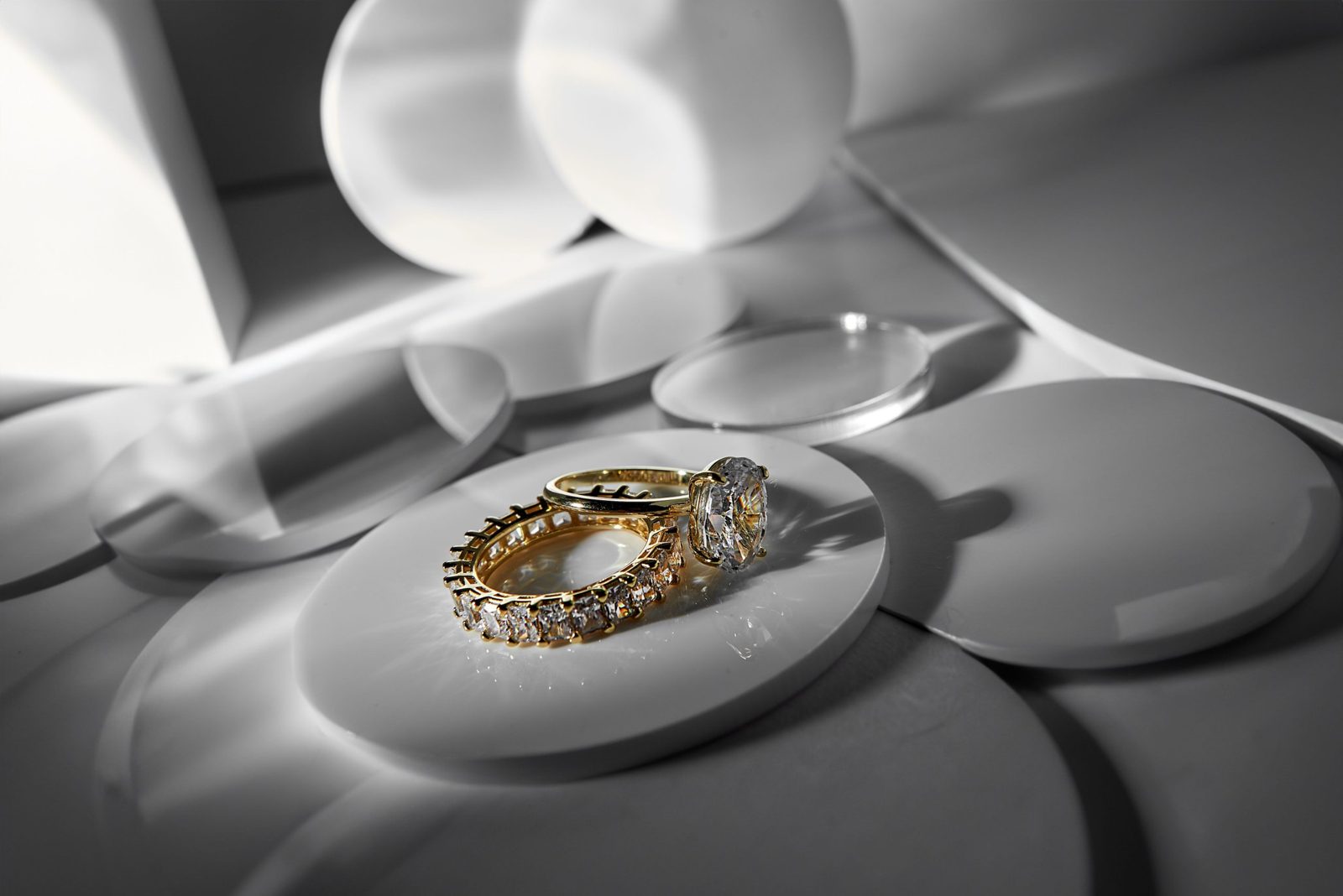 An oval lab-grown diamond solitaire with a matching eternity band in yellow gold